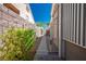 Side yard access featuring a secure gate and space for outdoor storage at 10301 Bent Brook Pl, Las Vegas, NV 89134