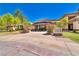 Welcoming theater entrance with colorful signage and manicured landscaping, inviting guests for entertainment at 10301 Bent Brook Pl, Las Vegas, NV 89134