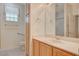 Bathroom featuring a single sink, a walk-in shower and accessibility features at 10302 Cara Mia Ct, Las Vegas, NV 89135