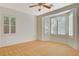 Bright bedroom with wood floors and large windows offering lots of natural light at 10302 Cara Mia Ct, Las Vegas, NV 89135