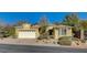 Inviting single-story home with well-maintained landscaping and attached two-car garage at 10302 Cara Mia Ct, Las Vegas, NV 89135