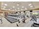 Well-equipped gym with modern treadmills, weight machines, and ample space for fitness activities at 10302 Cara Mia Ct, Las Vegas, NV 89135