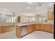 Bright eat-in kitchen featuring stainless steel appliances, wooden cabinets, and lots of counter space at 10302 Cara Mia Ct, Las Vegas, NV 89135