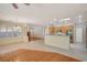 Open concept kitchen with stainless steel appliances, tile flooring, and backyard views at 10302 Cara Mia Ct, Las Vegas, NV 89135