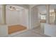 Open-concept living space featuring wood floors, arched doorways, and decorative columns at 10302 Cara Mia Ct, Las Vegas, NV 89135
