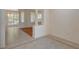 Open-concept living area with tile and wood flooring, defined by decorative columns at 10302 Cara Mia Ct, Las Vegas, NV 89135