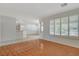 Bright, open-concept space with wood floors and shuttered windows to the outdoors at 10302 Cara Mia Ct, Las Vegas, NV 89135