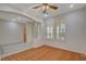 Bright living space with wood flooring, tiled entry, arched entryway and large window with plantation shutters at 10302 Cara Mia Ct, Las Vegas, NV 89135