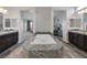 Bright bathroom featuring dual vanities, standalone tub, and granite countertops at 11088 Westcroft Way, Las Vegas, NV 89183