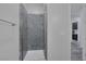 Bathroom showing a modern shower with stone tiling and glass enclosure, exuding minimalist elegance at 11088 Westcroft Way, Las Vegas, NV 89183