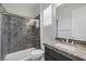 Modern bathroom featuring a sleek glass-enclosed shower, granite countertop, and stylish fixtures at 11088 Westcroft Way, Las Vegas, NV 89183