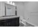 Contemporary bathroom showcases granite countertop, black cabinetry, toilet, and sleek fixtures at 11088 Westcroft Way, Las Vegas, NV 89183