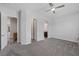 Spacious bedroom with carpet flooring, ceiling fan, and ensuite bathroom at 11088 Westcroft Way, Las Vegas, NV 89183
