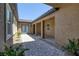Paver courtyard features covered walkway and desert landscaping at 11088 Westcroft Way, Las Vegas, NV 89183
