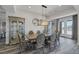 Elegant dining room features a decorative cabinet, dining table and chairs, and access to the patio at 11088 Westcroft Way, Las Vegas, NV 89183