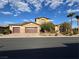 Beautiful two-story home featuring a three-car garage, desert landscaping, and a tile roof at 11088 Westcroft Way, Las Vegas, NV 89183