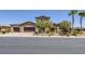 Beautiful two-story home featuring a three-car garage, desert landscaping, and a tile roof at 11088 Westcroft Way, Las Vegas, NV 89183