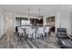 Spacious kitchen featuring dark cabinetry, stainless steel appliances, a center island, and pendant lighting at 11088 Westcroft Way, Las Vegas, NV 89183