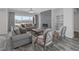 Inviting living room featuring a fireplace, large windows, and modern decor at 11088 Westcroft Way, Las Vegas, NV 89183