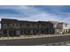 Beautiful townhome exterior showcasing modern architecture, landscaping, and inviting curb appeal at 124 Silver Run Ln, Las Vegas, NV 89138