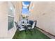 Small backyard with artificial turf and an outdoor seating area at 1259 Plum Canyon St, Las Vegas, NV 89142