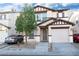 Charming two-story home with a one-car garage and well-maintained front yard at 1259 Plum Canyon St, Las Vegas, NV 89142