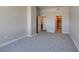 Neutral-toned bedroom with gray carpet, doorways, and a closet at 150 Las Vegas Blvd # 2003, Las Vegas, NV 89101