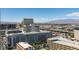 Striking city view featuring modern architecture, a clear sky, and distant mountains at 150 Las Vegas Blvd # 2003, Las Vegas, NV 89101