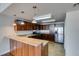 Modern kitchen featuring stainless steel appliances, granite countertops, and warm wood cabinetry at 150 Las Vegas Blvd # 2003, Las Vegas, NV 89101