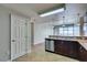 Bright open-concept kitchen featuring stainless steel dishwasher and granite countertops at 150 Las Vegas Blvd # 2003, Las Vegas, NV 89101