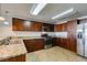 Well-lit kitchen showcases stainless steel appliances, granite countertops, and custom wood cabinets at 150 Las Vegas Blvd # 2003, Las Vegas, NV 89101