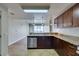 Open concept kitchen featuring stainless steel dishwasher, granite countertops, and custom cabinets at 150 Las Vegas Blvd # 2003, Las Vegas, NV 89101
