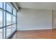Bright living room featuring hardwood floors and a large window showcasing city views at 150 Las Vegas Blvd # 2003, Las Vegas, NV 89101