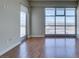 Bright living room with hardwood floors, city views through expansive windows at 150 Las Vegas Blvd # 2003, Las Vegas, NV 89101