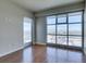 Well-lit living room with hardwood floors and city views through expansive windows at 150 Las Vegas Blvd # 2003, Las Vegas, NV 89101
