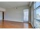 Bright living room with hardwood floors, balcony access, and views of the city at 150 Las Vegas Blvd # 2003, Las Vegas, NV 89101