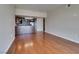 Open-concept living room with hardwood floors and an adjacent modern kitchen area at 150 Las Vegas Blvd # 2003, Las Vegas, NV 89101