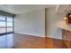 Open concept living room with wood floors and floor to ceiling windows with city views at 150 Las Vegas Blvd # 2003, Las Vegas, NV 89101