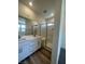 Bright bathroom with double vanity, a glass-enclosed shower, and modern fixtures at 1533 Bat Hawk St, Las Vegas, NV 89144