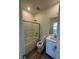 Clean bathroom featuring a shower-tub combo with sliding glass doors and a white vanity at 1533 Bat Hawk St, Las Vegas, NV 89144