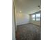 Cozy bedroom with plush carpeting and scenic views from the large windows at 1533 Bat Hawk St, Las Vegas, NV 89144