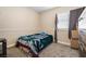 Simple bedroom with neutral carpeting, single bed, and bright natural light at 1680 Sweet Pea Ave, Las Vegas, NV 89183