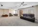 Large bonus room with plush carpet, multiple ceiling fans, and ample space for entertaining at 1680 Sweet Pea Ave, Las Vegas, NV 89183