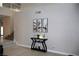 Welcoming foyer with decorative console table and artwork, adjacent to the staircase at 1680 Sweet Pea Ave, Las Vegas, NV 89183