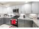 Updated kitchen with granite countertops, stainless steel appliances, and white subway tile backsplash at 1680 Sweet Pea Ave, Las Vegas, NV 89183