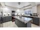 Modern kitchen featuring granite counters, stainless steel appliances, and tile flooring at 1680 Sweet Pea Ave, Las Vegas, NV 89183