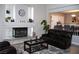 Comfortable living room features a fireplace, area rug, and cozy seating at 1680 Sweet Pea Ave, Las Vegas, NV 89183