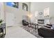 Bright living room with a fireplace, lots of light from large windows, and tile flooring at 1680 Sweet Pea Ave, Las Vegas, NV 89183