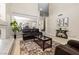 Spacious living room with tile flooring and a view of the dining area at 1680 Sweet Pea Ave, Las Vegas, NV 89183