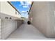 Wide side yard featuring concrete patio and block wall fencing at 1680 Sweet Pea Ave, Las Vegas, NV 89183